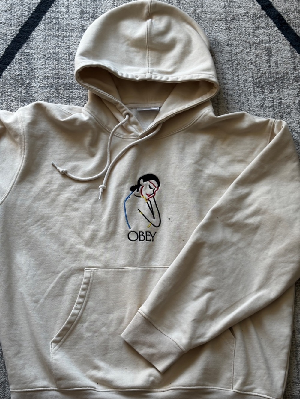 Obey Men's Cream Hoodie with Minimal Embroidered Portrait